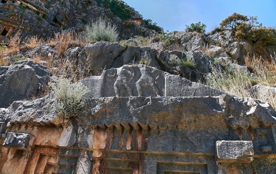 Koycegiz, Mugla, Turkey - July 12 2017: The rock tombs of the kings in the ancient city of Kaunos in Koycegiz Dalyan