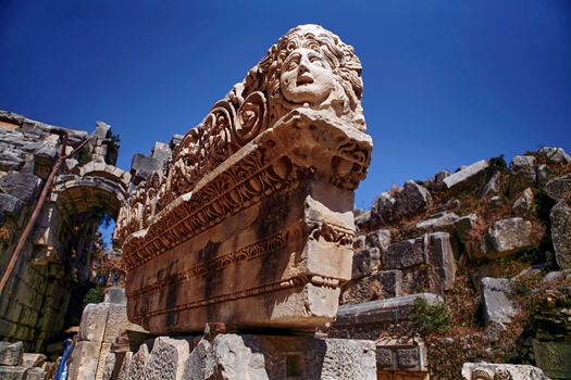 Stone Theater masks in Myra Ancient City. Demre, Antalya, Turkey