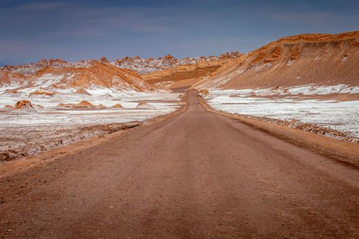 Dirt Road in Peaceful Moon Valley dramatic landscape at Sunset, Atacama Desert, Chile