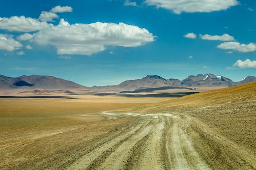 Dirt Road in Peaceful Moon Valley dramatic landscape at Sunset, Atacama Desert, Chile