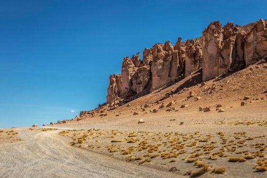Dirt Road in Peaceful Moon Valley dramatic landscape at Sunset, Atacama Desert, Chile