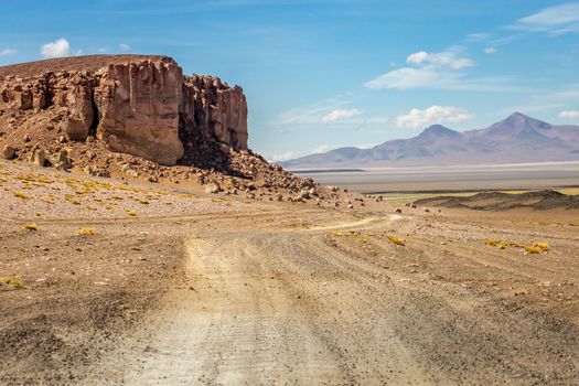 Dirt Road in Peaceful Moon Valley dramatic landscape at Sunset, Atacama Desert, Chile