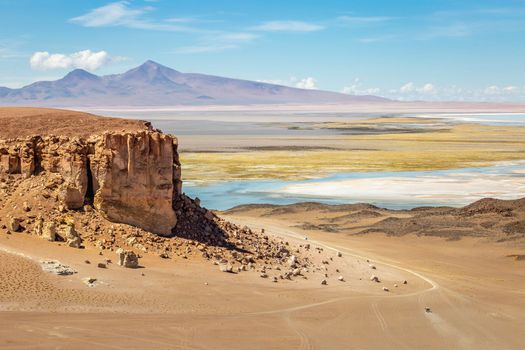 Salt lake reflection and idyllic volcanic landscape at Sunset, Atacama desert, Chile border with Bolivia