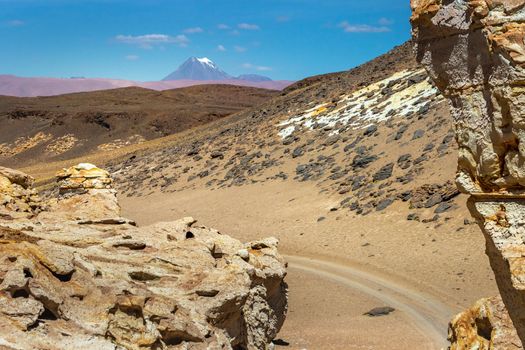 Dirt Road in Peaceful Moon Valley dramatic landscape at Sunset, Atacama Desert, Chile