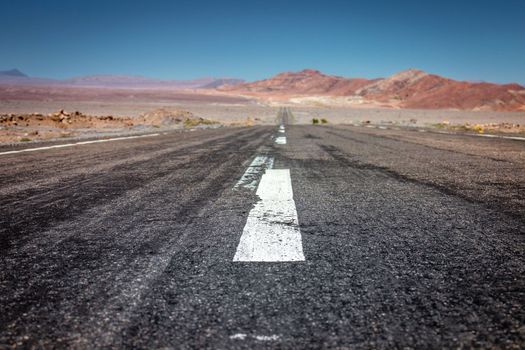Road in Peaceful Moon Valley dramatic landscape at Sunset, Atacama Desert, Chile