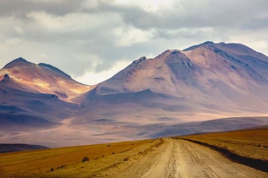 Dirt Road in Peaceful Moon Valley dramatic landscape at Sunset, Atacama Desert, Chile