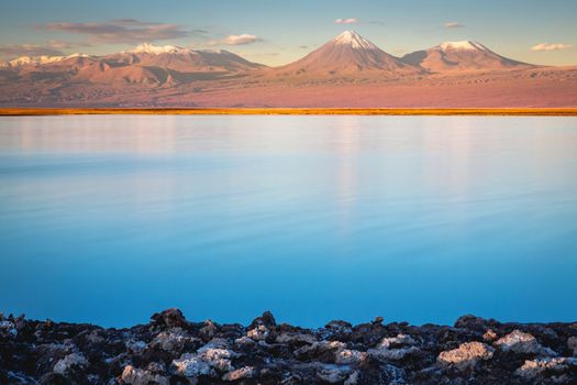 Licancabur and Peaceful reflection lake with dramatic volcanic landscape at Sunset, Atacama Desert, Chile