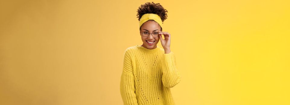 Attractive friendly charismatic female programmer frontend developer smiling broadly check glasses nose look confident lucky have excellent idea improve app workability, standing yellow background.