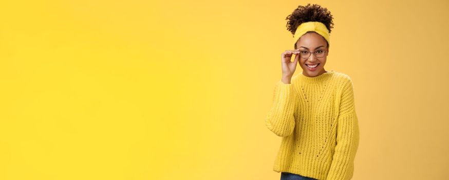 Attractive friendly charismatic female programmer frontend developer smiling broadly check glasses nose look confident lucky have excellent idea improve app workability, standing yellow background.