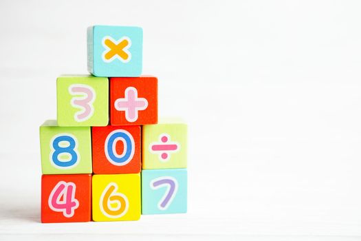 Number wood block cubes for learning Mathematic, education math concept.