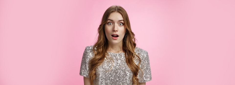 Amazed shocked surprised attractive young female singer being chosen lucky girl picked win lottery widen eyes gasping stupor astonished widen eyes amazement, posing impressed pink background.