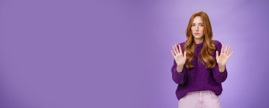 I pass, not even look at me. Portrait of displeased sorrow and intense redhead woman refusing participate in suspicious plan waving hands near chest in rejection looking serious at camera. Copy space