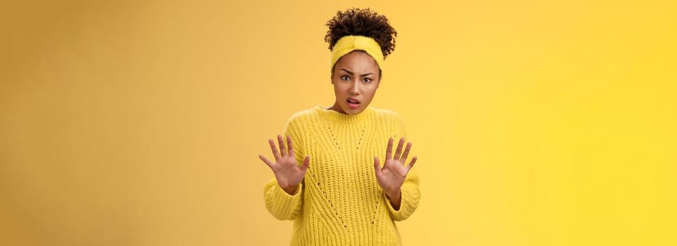 Arrogant ignorant disappointed reluctant fashionable popular african american girl university student reject awful offer raise hands stop enough refusal rejection gesture look shocked offended.