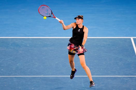 MELBOURNE, AUSTRALIA - JANUARY 24: Elena Rybakina of Russia plays Jelena Ostapenko of Latvia in quarter finals action on day 9 of the 2023 Australian Open at Melbourne Park on January 24, 2023 in Melbourne, Australia.
