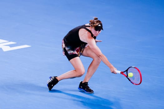 MELBOURNE, AUSTRALIA - JANUARY 24: Elena Rybakina of Russia plays Jelena Ostapenko of Latvia in quarter finals action on day 9 of the 2023 Australian Open at Melbourne Park on January 24, 2023 in Melbourne, Australia.
