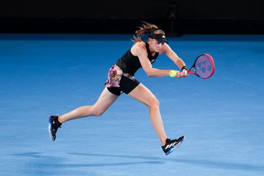 MELBOURNE, AUSTRALIA - JANUARY 24: Elena Rybakina of Russia plays Jelena Ostapenko of Latvia in quarter finals action on day 9 of the 2023 Australian Open at Melbourne Park on January 24, 2023 in Melbourne, Australia.