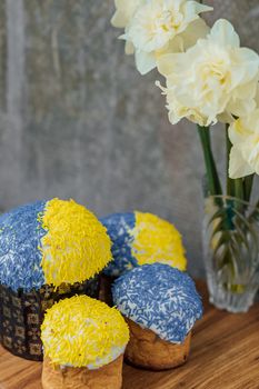 Delicious Easter cake and ingredients on wooden table.