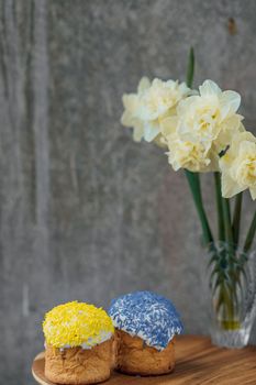 Delicious Easter cake and ingredients on wooden table.