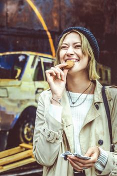 woman eating cookies made with marijuana cake medicinal edibles drug consumption concept