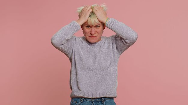 Young pretty woman feeling hopelessness loneliness, nervous breakdown, loses becoming surprised by lottery results, bad fortune, loss, unlucky news. Girl on pink background. Lgbt gay lesbian people