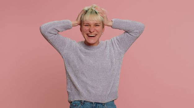 Woman with short hair laughing out loud after hearing ridiculous anecdote, funny joke, feeling carefree amused, positive people lifestyle. Young millennial girl on pink background. Lgbt gay lesbian