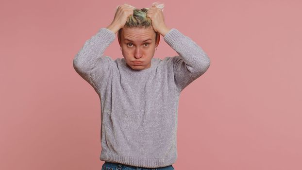 Upset scared frightened woman feeling worried nervous about serious troubles, stress and anxiety disorder, panic attack guilty. Girl on studio pink background. Lgbt gay lesbian people