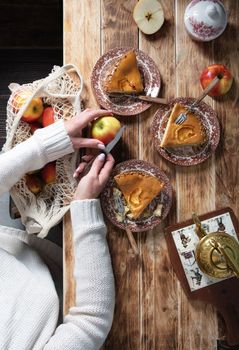 woman cuts an apple for making apple pie, top view still life. High quality photo