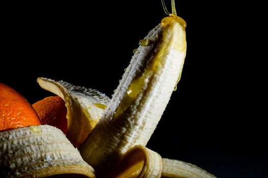 Close-up eating peeled banana
