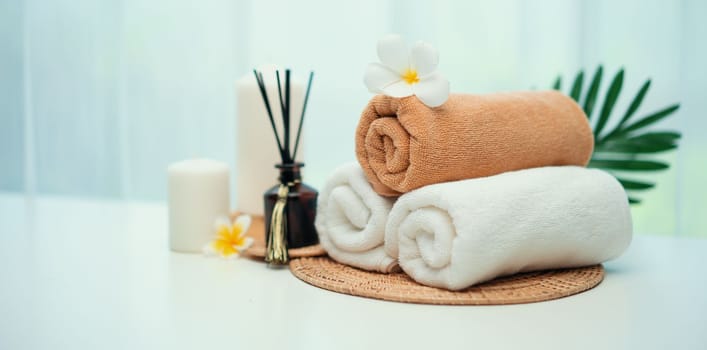 Spa accessory composition set in day spa hotel , beauty wellness center . Spa product are placed in luxury spa resort room , ready for massage therapy from professional service .