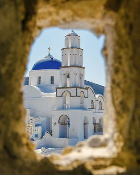 Pyrgos Santorini Greece on a sunny day during summer with whitewashed homes and churches, the Greek Island Aegean Cyclades