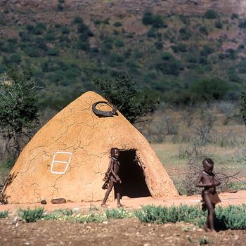 May 15, 2005.Himba village. unidentified Himba boy. Epupa Falls, Kaokoland or Kunene Province, Namibia, Africa