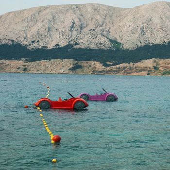 Water games on the beach in Baska
