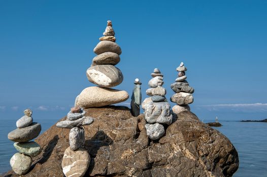 balanced stones on the rocks of the sea