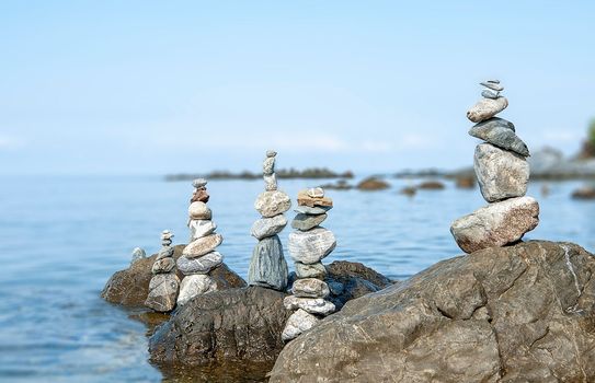 balanced stones on the rocks of the sea