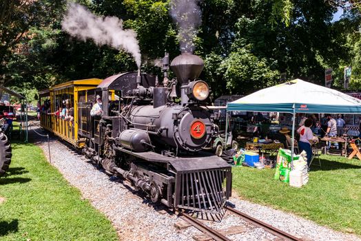 Kinzers, Pennsylvania, August 18, 2022 - View of Steam and Tractor Event with Antique Tractors of all Types on a Sunny Summer Day