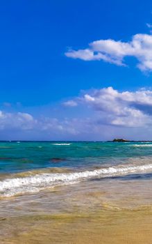 Tropical caribbean beach landscape panorama with clear turquoise blue water in Playa del Carmen Mexico.