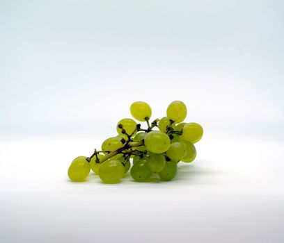 Green grapes. Green grapes on a white background.