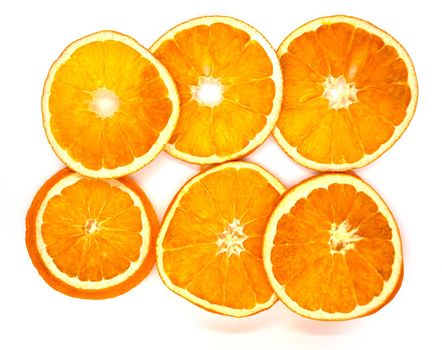 Dried orange slices. Dried orange slices on a white background, close-up.