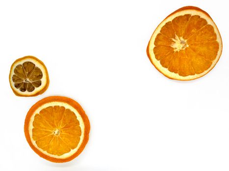 Slices of dried orange and lemon. Slices of dried orange and lemon on a white background, close-up.