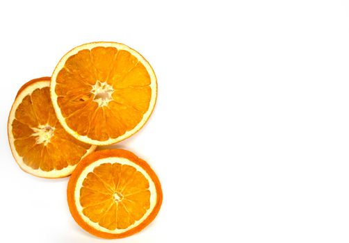 Dried orange slices. Slices of dried orange on a white background, close-up.