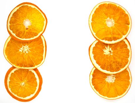 Dried orange slices, background. Dried orange slices on a white background, close-up.