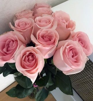 Bouquet of roses. The photo shows a bouquet of pink roses on the table.