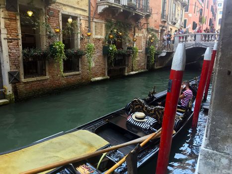 Italy, Venice. September 1, 2019. View of the canal and the boat.