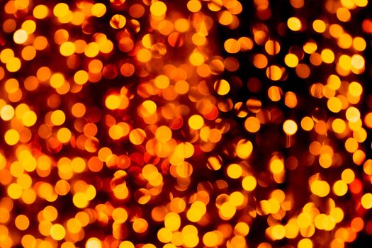 Defocused city gold night bokeh abstract background. blurred many round yellow light on dark background.