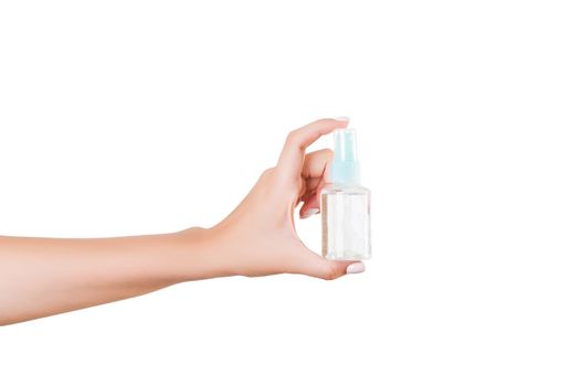 Female hand holding cream bottle of lotion isolated. Girl give tube cosmetic products on white background.