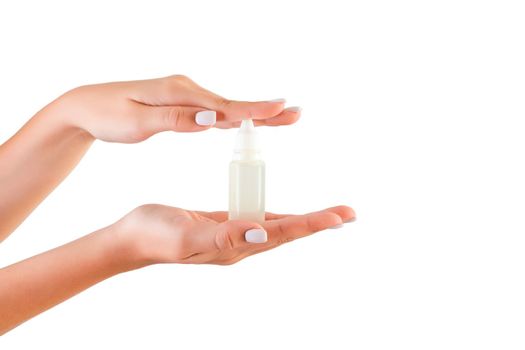 Female hand holding cream bottle of lotion isolated. Girl give tube cosmetic products on white background.