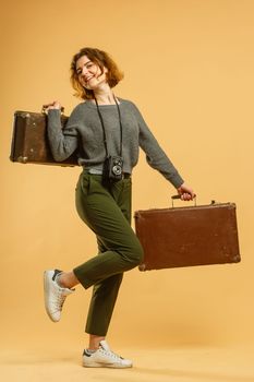 travel woman with a retro suitcase.