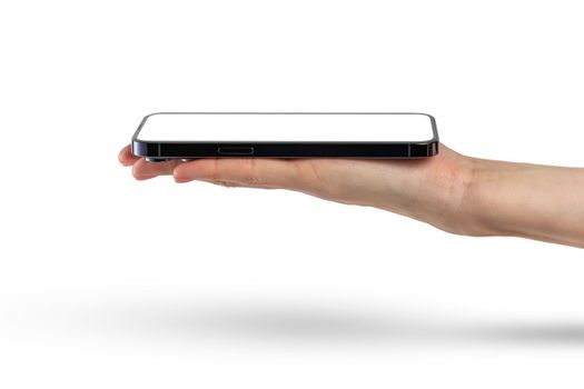 Phone in hand isolate on white background. A modern smartphone lies on the palm with the screen up, side view, mockup for insertion into the project.