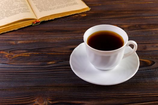 Cup of coffee on a wooden table.