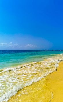 Tropical caribbean beach landscape panorama with clear turquoise blue water in Playa del Carmen Mexico.